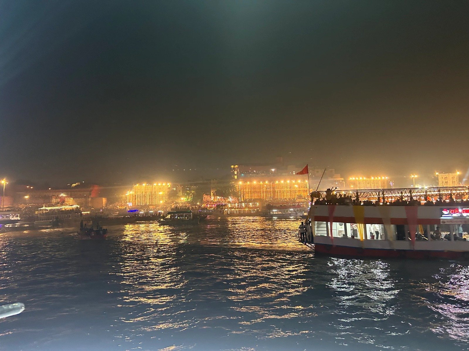 Lamps floating on the Ganga during deep-daan on Dev Deepawali in Varanasi, from a Kashi & Kin boat last year
