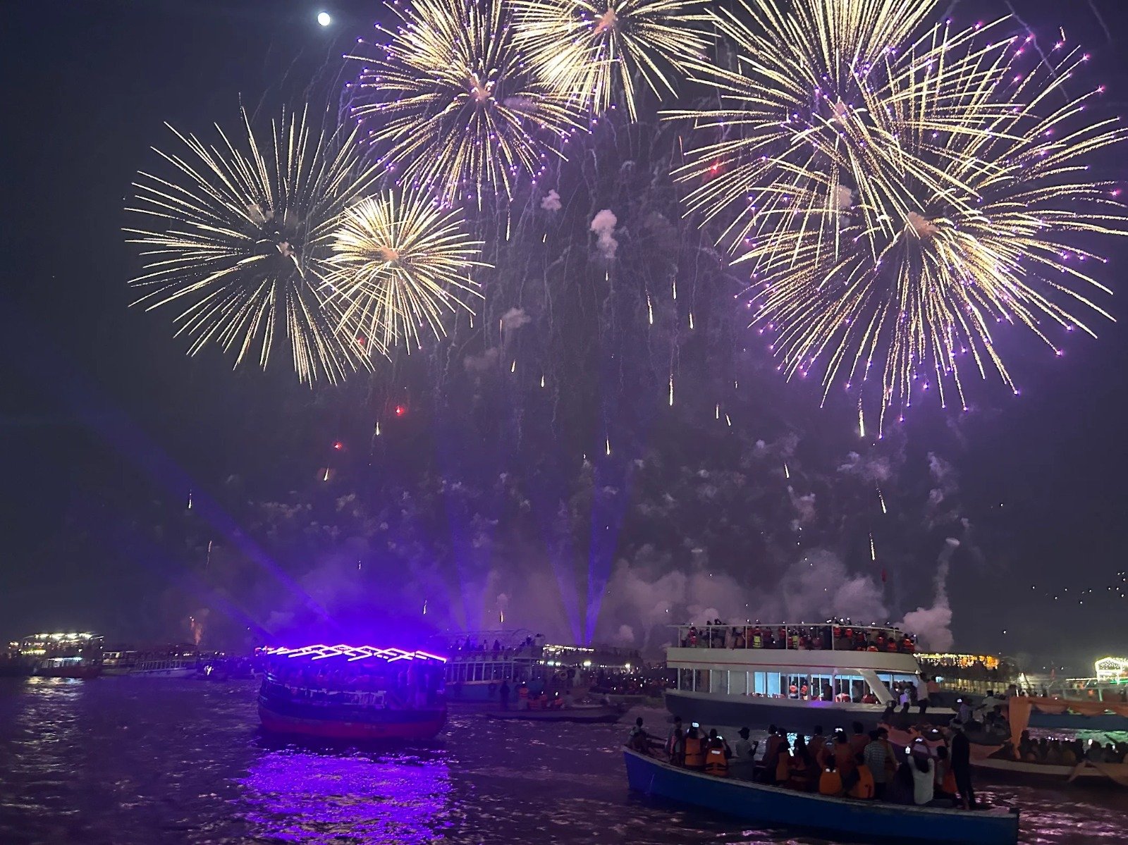 Fireworks over the illuminated Varanasi riverfront on Dev Deepawali night, from a Kashi & Kin boat last year