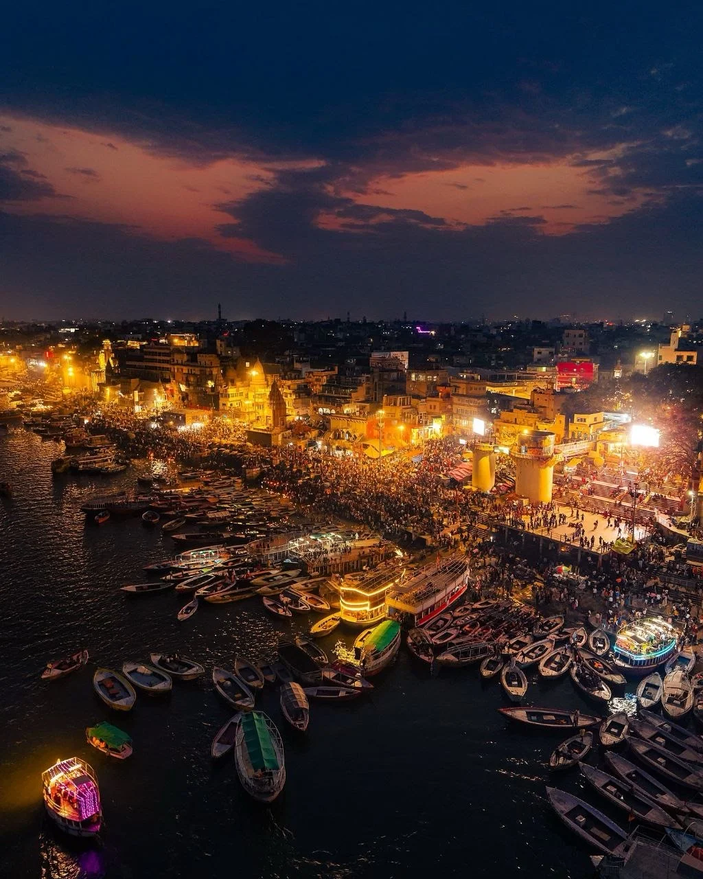 The Varanasi ghats glowing at night along the Ganga
