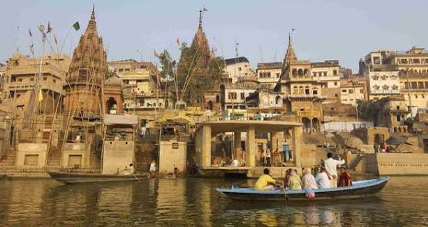 Boats on the Ganga at sunrise beside the ghats of Varanasi