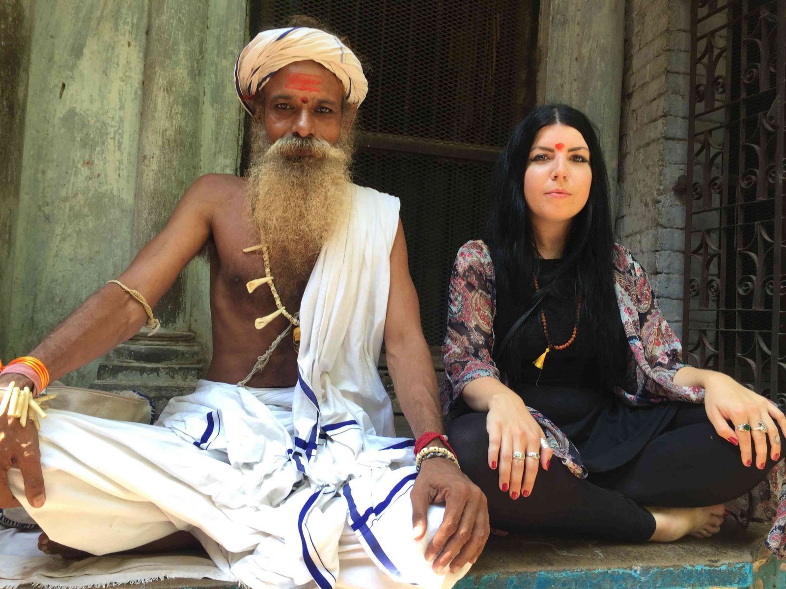 foreigner with sadhu in varanasi